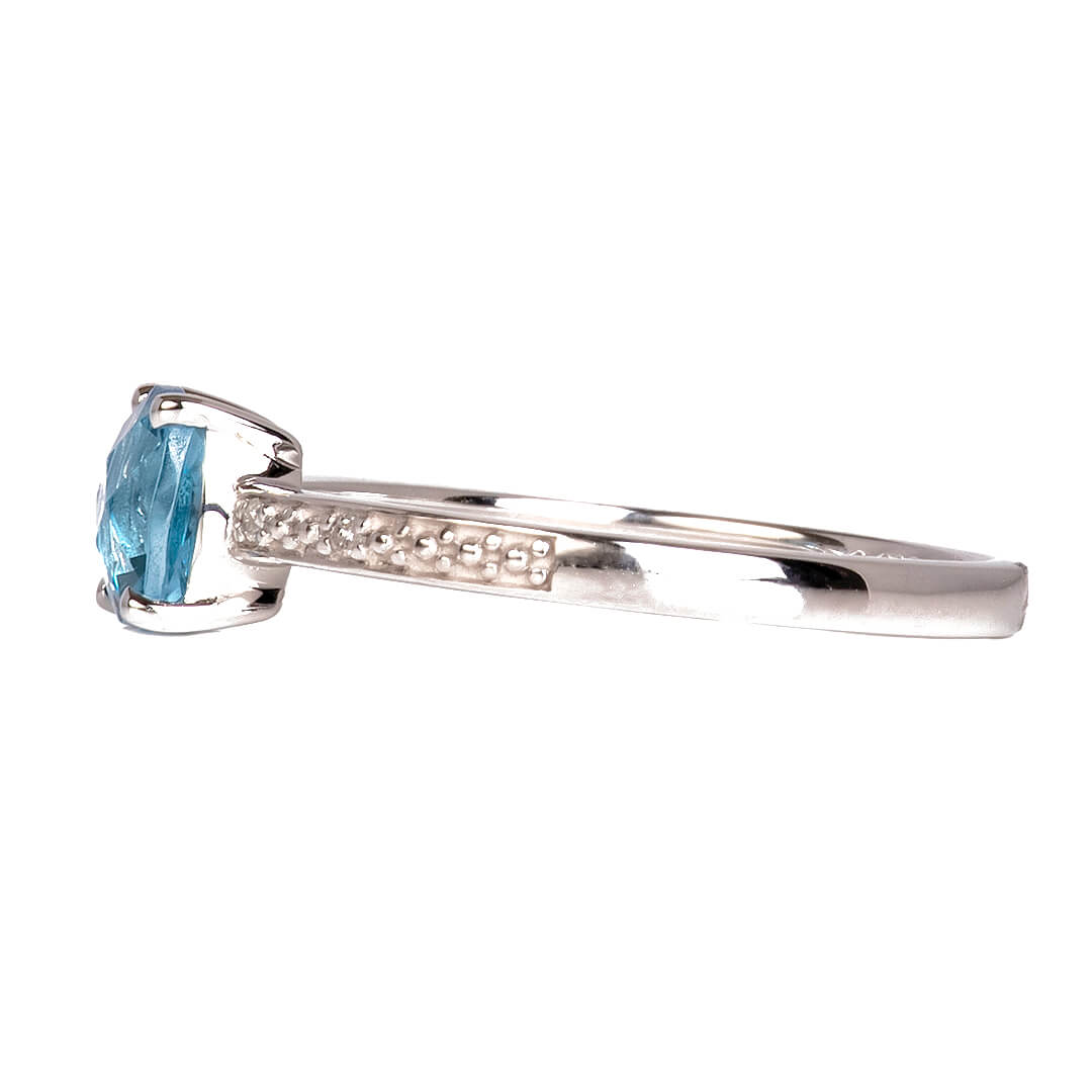 Anillo con Topacio Swiss Blue con Diamantes Nat 0.02qts