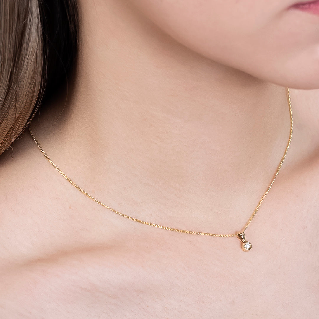 Dije de Diamante 0.10qts con Cadena