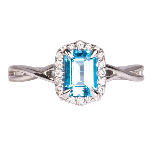 Anillo Topacio Swiss Blue con Halo de Diamantes Nat 0.15qts con Brazos