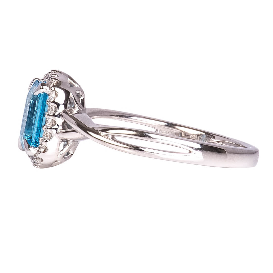 Anillo Topacio Swiss Blue con Halo de Diamantes Nat 0.15qts con Brazos