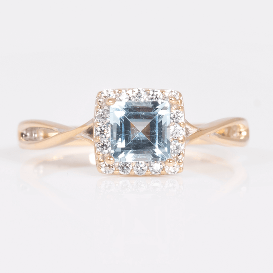 Anillo con Topacio Cuadrado con Halo de Circonias y Brazos Cruzados